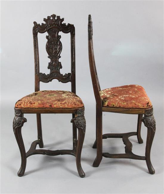 A pair of mid 18th century walnut chairs, probably Liege,